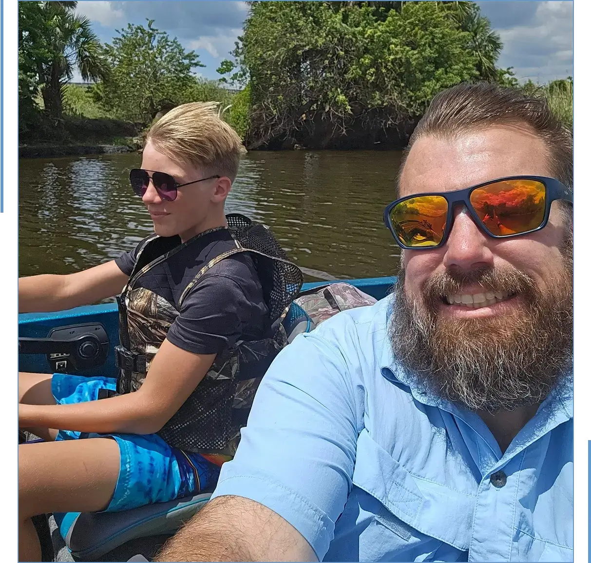 Two people boating on a sunny day.