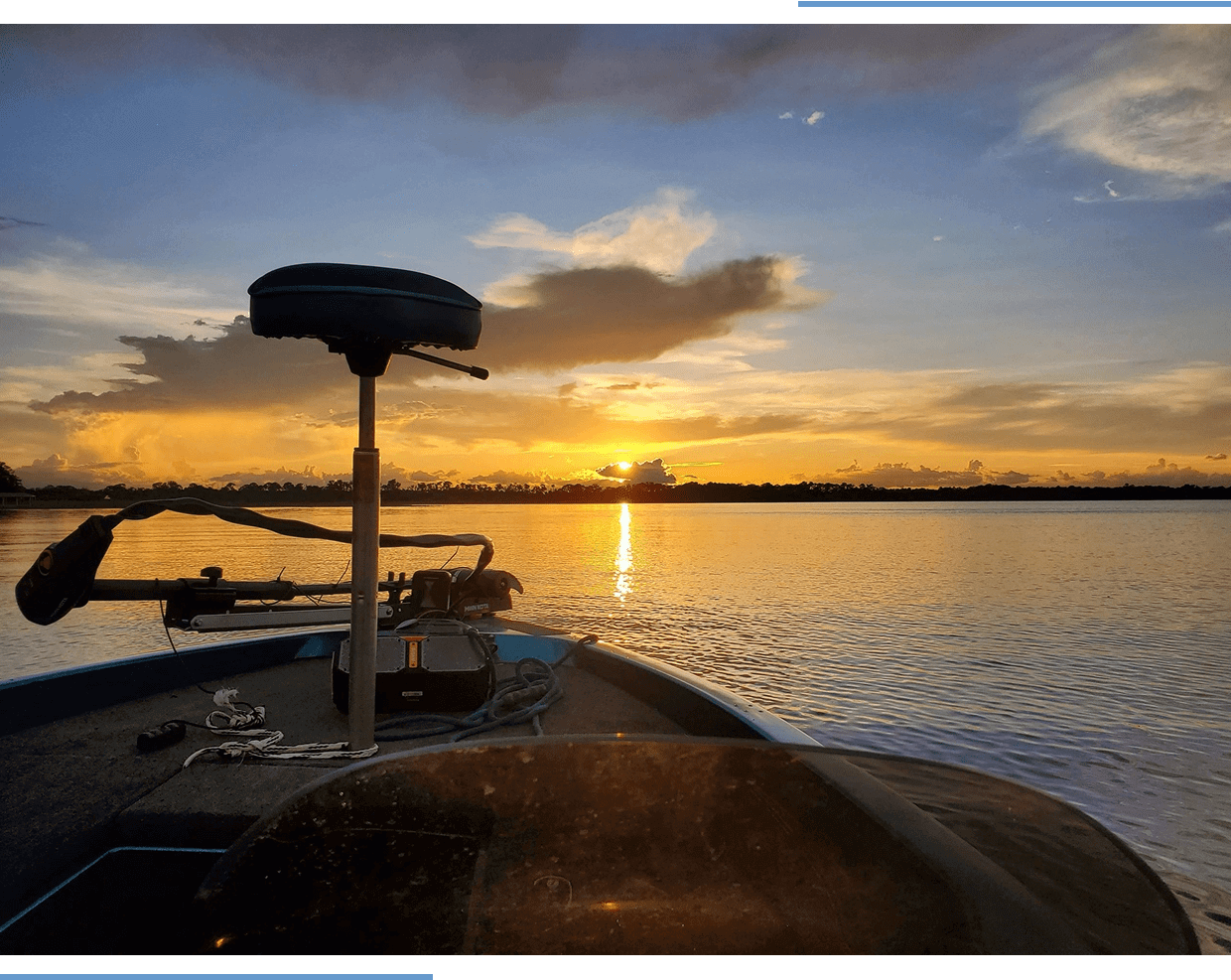 Boat on lake during a beautiful sunset.